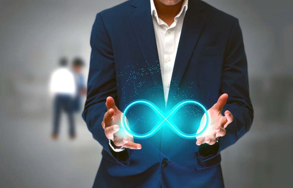 DevOps concept, an IT engineer holding the glowing devops symbol that illustrates the software development practices that automates the continuous development, build integration and deployment process MastHead Brewing Co in Cleveland Bar